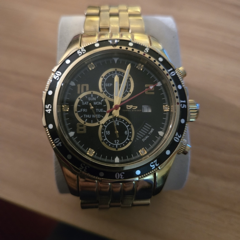 Daniel Steiger Men’s Quartz Movement Black Dial Gold Band Wristwatch